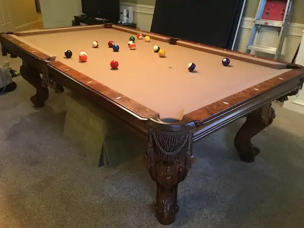 pool table moving service in Katy TX, game room table leveled with a machinist level