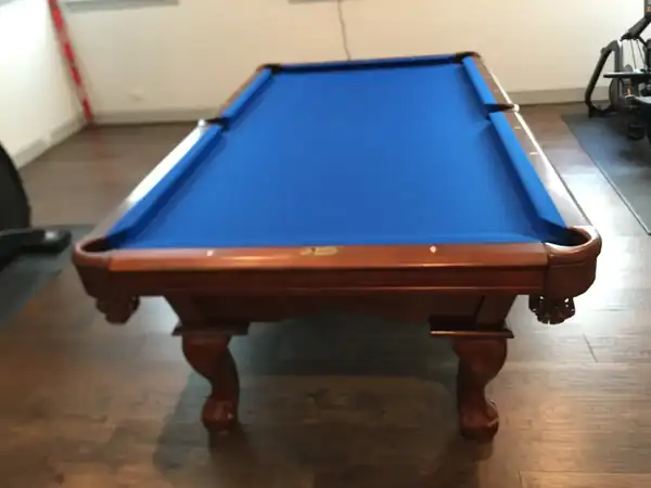 pool table refelting Abilene TX, new cloth installed on bed and rails
