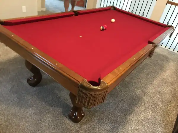 used connelly pool table for sale in houston, classic table with red cloth and fringed pockets, inspected