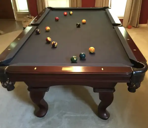 pool table movers Pearland TX, game room table leveled with a machinist level