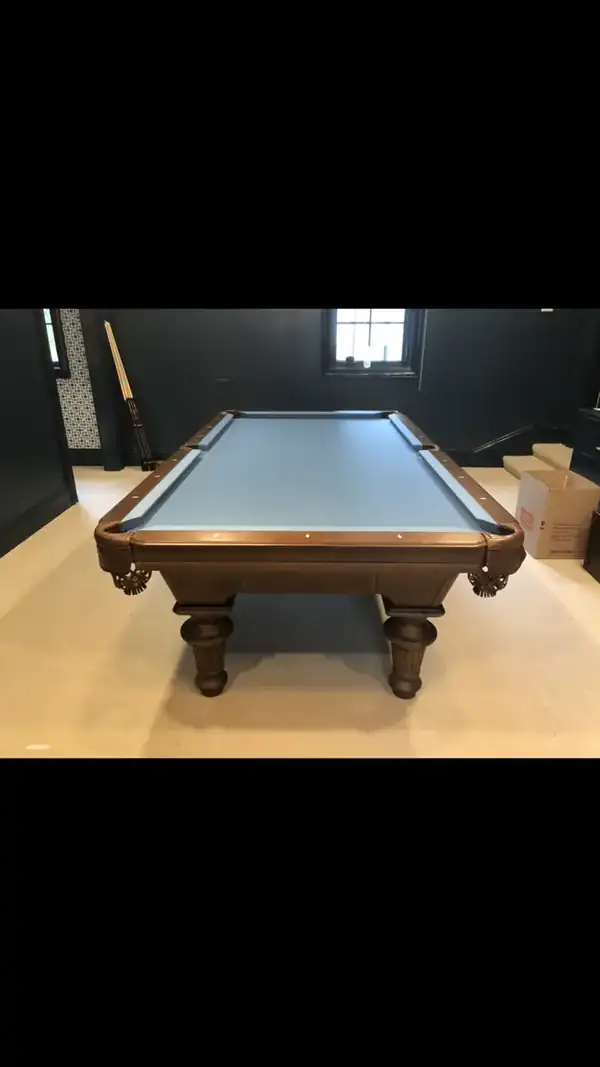pool table movers Houston TX, game room table leveled with a machinist level