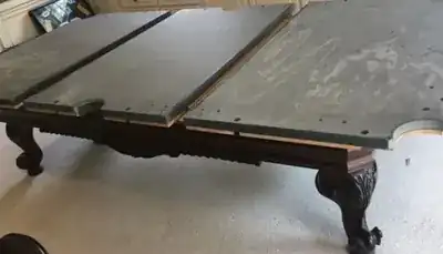 pool table moving service - crew loading a wrapped slate table